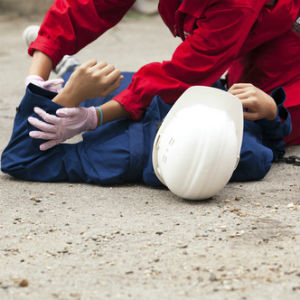 Man helping an injured construction worker