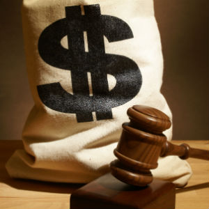 a sack of money with a gavel